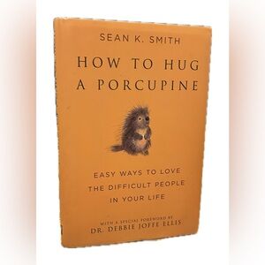 Hardback Book. “How to Hug a porcupine.”